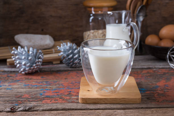 istock Milk cup on wooden on wooden background 931041504