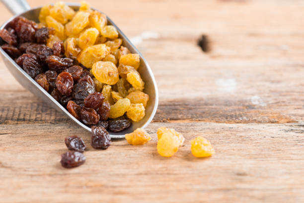 istock Raisins on a wood background. 931041572