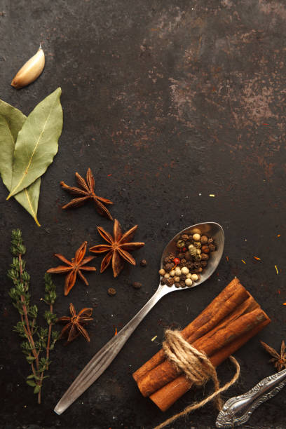 istock A lot of herbs and spices on black old table 931046490