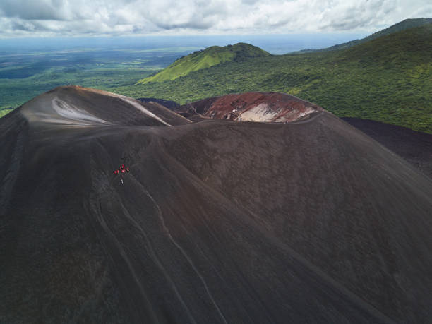 People on cerro negro volcano People on cerro negro volcano crater sliding on board activity aerial view fitzroy range stock pictures, royalty-free photos & images