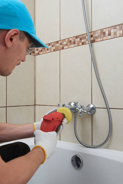 istock Worker polishing faucet of bathroom 931051796