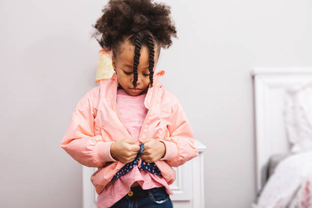 little girl getting ready for school