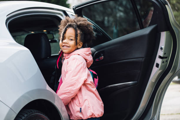 istock young girl going to school with parent 931055578