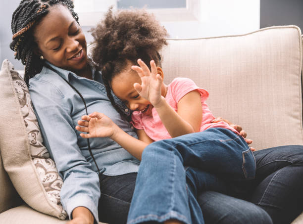 istock family fun on the couch 931055864