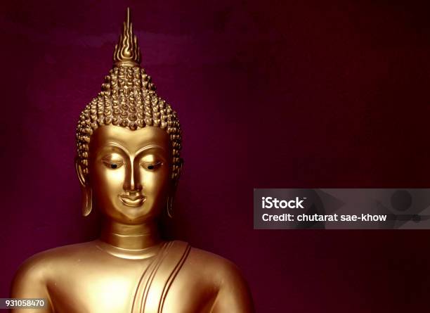 Gold Bhuddha Statue Close Up Smile Face On Vintage Dark Red Background Low Key Style Stock Photo - Download Image Now