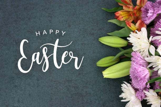 Happy Easter text over blackboard background with colorful flower blossom bouquet Spring season still life with Happy Easter text holiday script over dark blackboard background texture with beautiful colorful white, pink, orange, purple and green flower blossom bouquet on side, widescreen day lily photos stock pictures, royalty-free photos & images