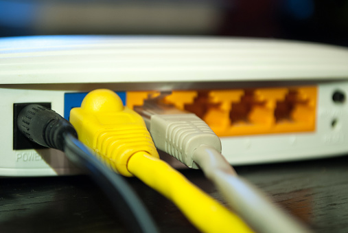 Utp Lan Cables Plugs In Wifi Router Photo - Download Image Now - Bandwidth, Blue, Business - iStock