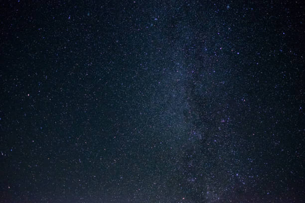 istock milky way galaxy long exposure photograph with grain. 931069634