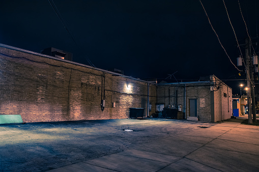Urban warehouse building and loading dock at night
