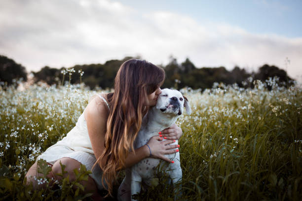 istock Girl playing with her dog 931078086