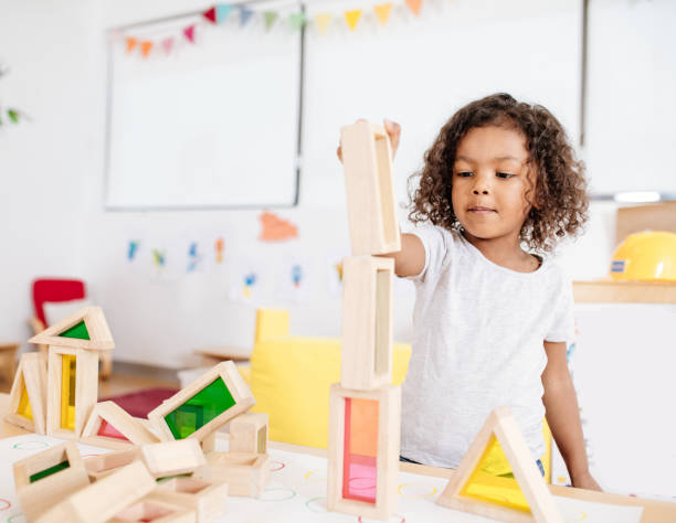 istock Adorable child with wooden blocks 931078464