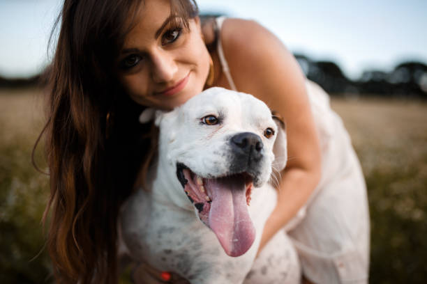 istock Girl playing with her dog 931078674