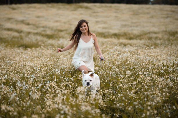 istock Girl playing with her dog 931079050
