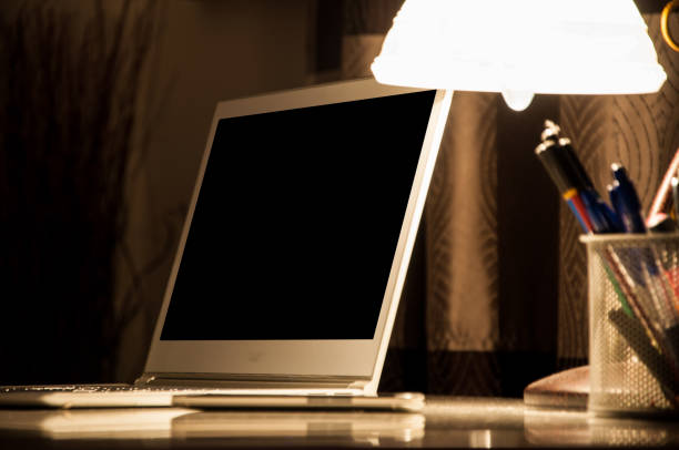 istock Laptop and lamp on the desk in workplace 931079390