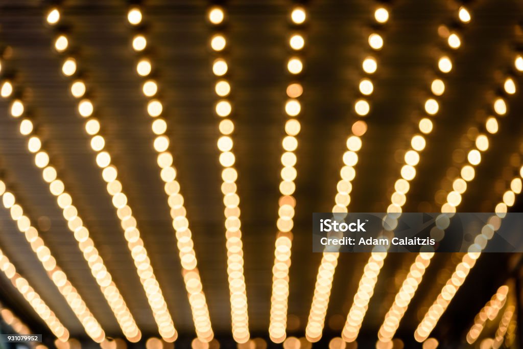 marquee lights Rows of illuminated globes under the marquee as often used at entrance to theatres and casinos Lighting Equipment Stock Photo