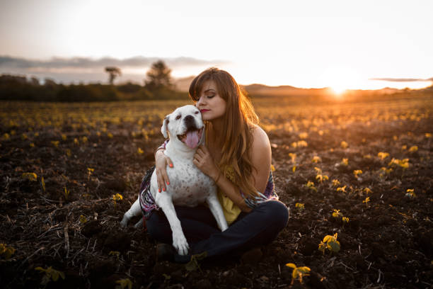 istock Girl playing with her dog 931079980