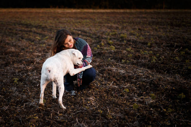 istock Girl playing with her dog 931080074