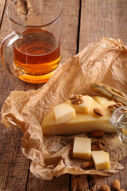 istock Gruyere cheese with beer on a wooden table 931082542