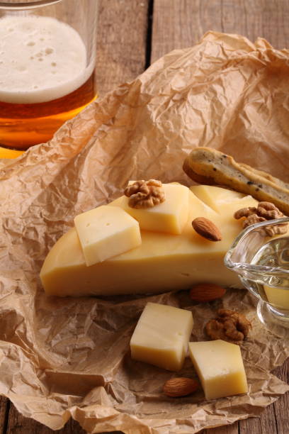 istock Gruyere cheese with beer on a wooden table 931082558