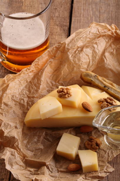 istock Gruyere cheese with beer on a wooden table 931082564