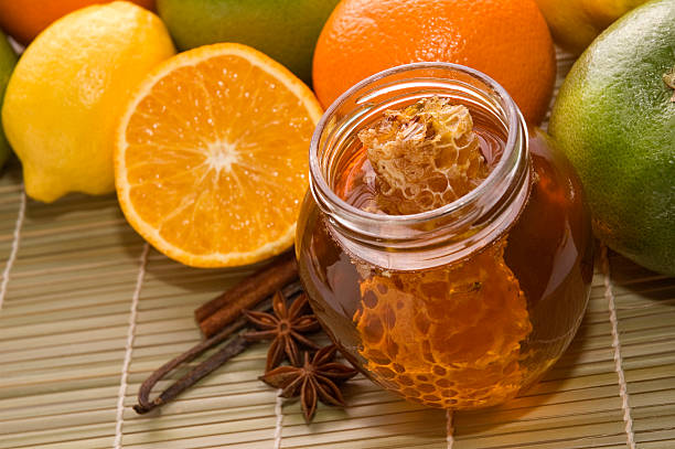 istock fresh honey with honeycomb, spices and fruits 93108627