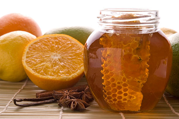 istock fresh honey with honeycomb, spices and fruits 93108630