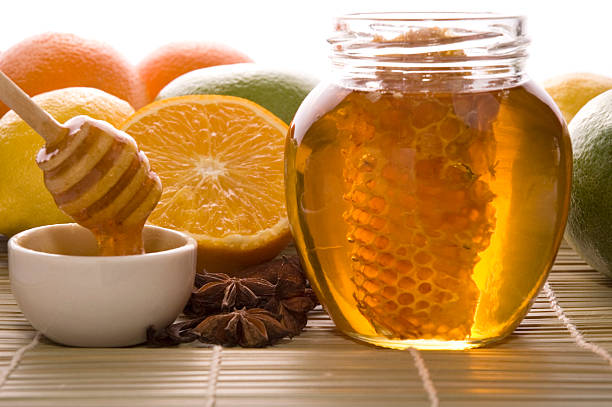 istock fresh honey with honeycomb, spices and fruits 93108634