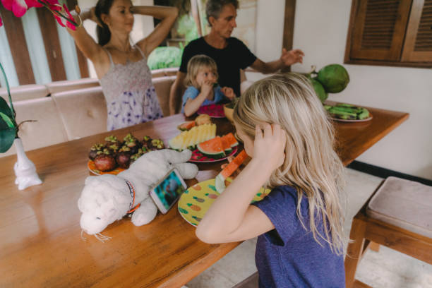 istock Family eats  tropical fruits on patio 931086762