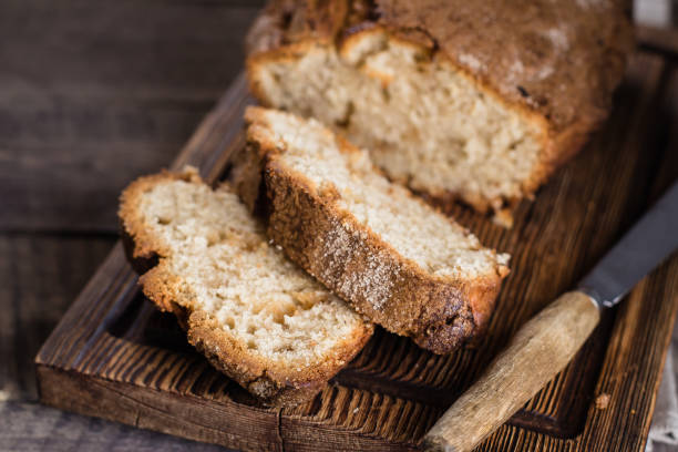 istock Homemade cinnamon cake bread on rustic wooden board on background table 931086922