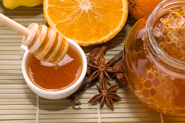istock fresh honey with honeycomb, spices and fruits 93108701
