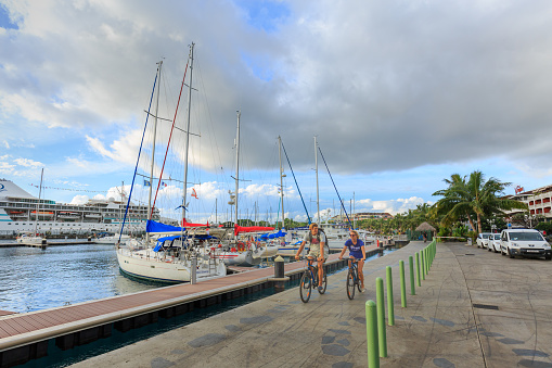 Papeete, French Polynesia – March 16, 2018 :  The sailing boat park at Large seaport in Tahiti PAPEETE, FRENCH POLYNESIA.