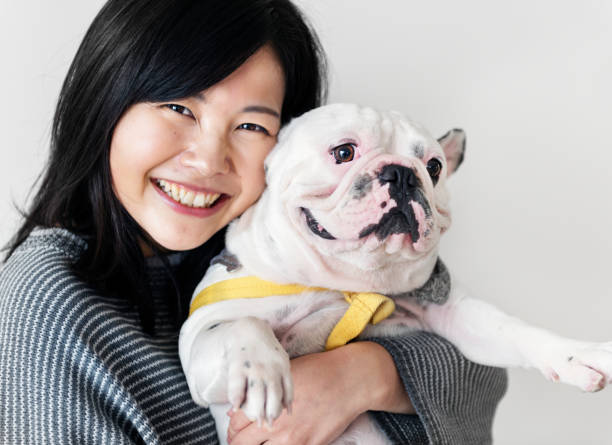 istock Asian woman hugging dog 931102948
