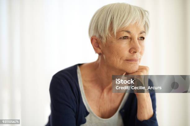 Reflecting On Lifes Experiences Stock Photo - Download Image Now - Mature Women, Worried, Contemplation
