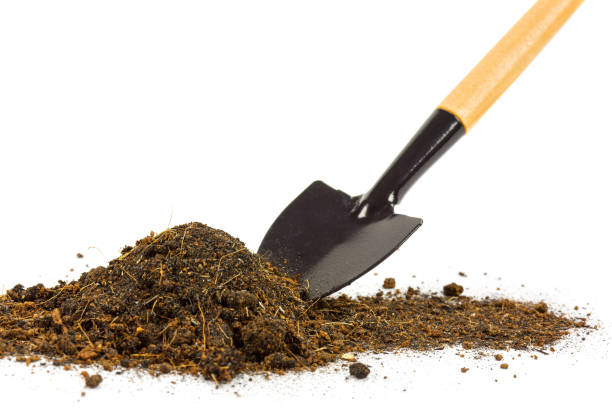 istock Pile of soil with small garden shovel tools 931110026