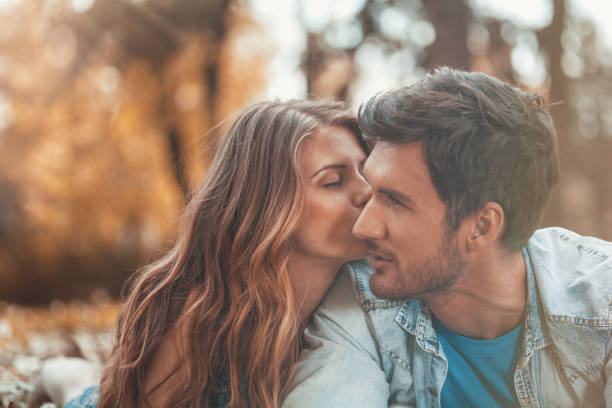 istock Woman kissing man 931113668