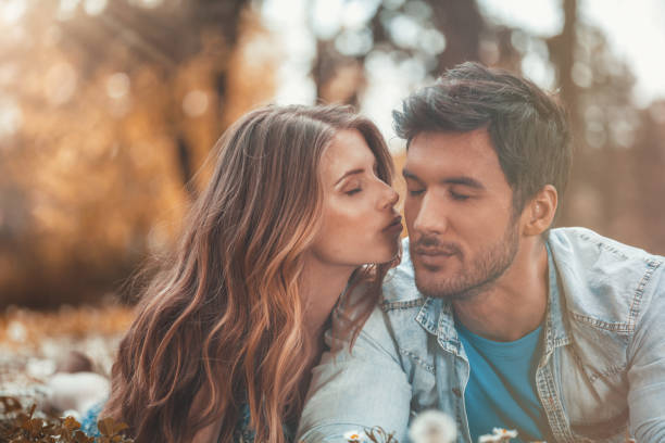 istock Woman kissing man on cheek 931113774