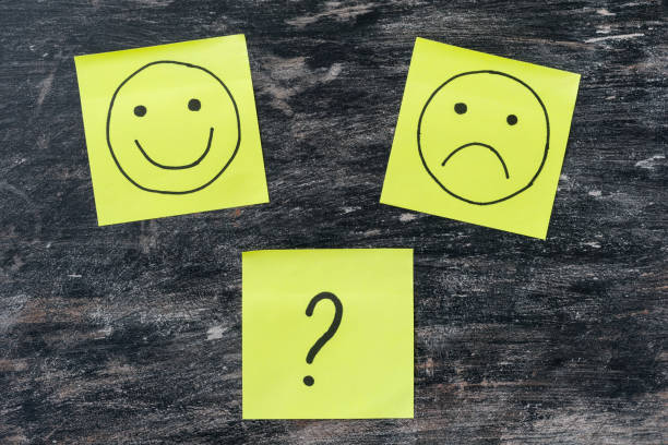 Hand drawing unhappy and happy smileys. Choice, question mark