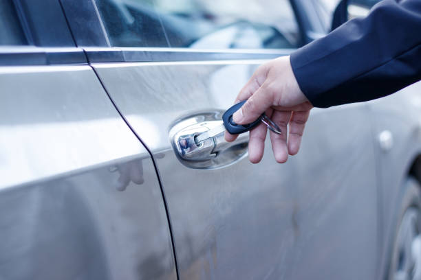 istock Businessman with car key. 931117680