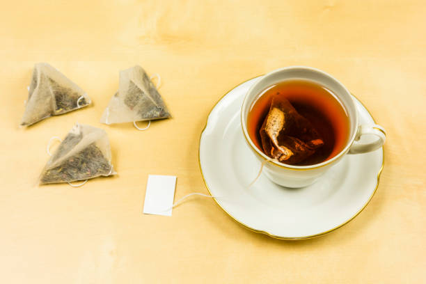 istock On the table a cup with freshly brewed tea from a bag. 931117928