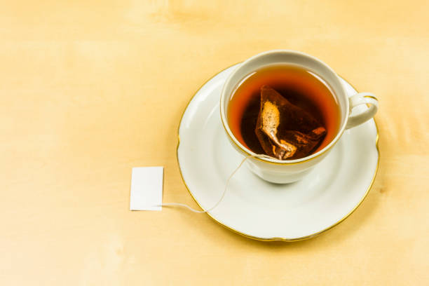istock On the table a cup in which tea from a bag was brewed. 931118122