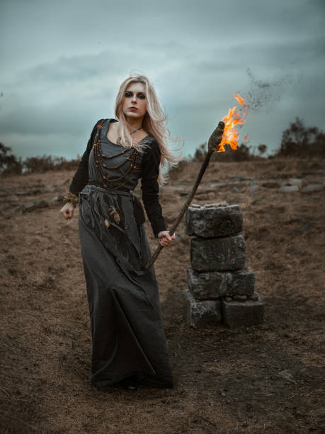 istock Witch in a long black dress 931118444