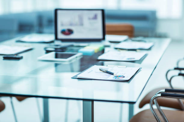 istock workplace with laptop and working documents for the business team in a modern office 931122036