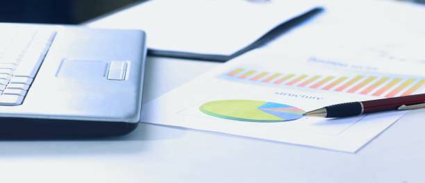 istock workplace with laptop and working documents for the business team in a modern office 931122186