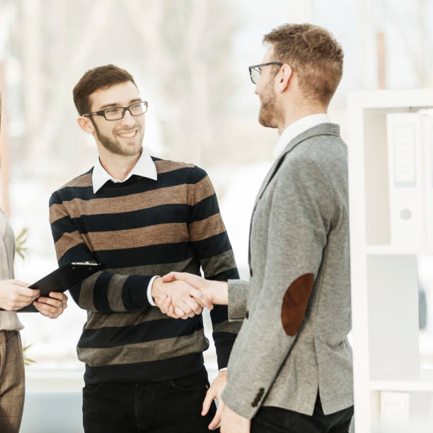 istock Manager shakes hands with the employee in a workplace in a modern office 931123418