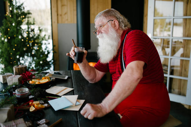 istock Santa Claus drinking mulled wine and thinking 931123896