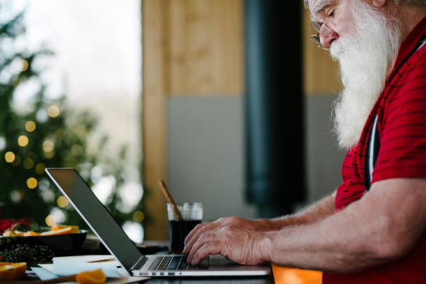 istock Santa Claus working with laptop 931124508