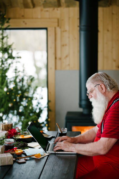 istock Serious blogger Santa Claus 931125216