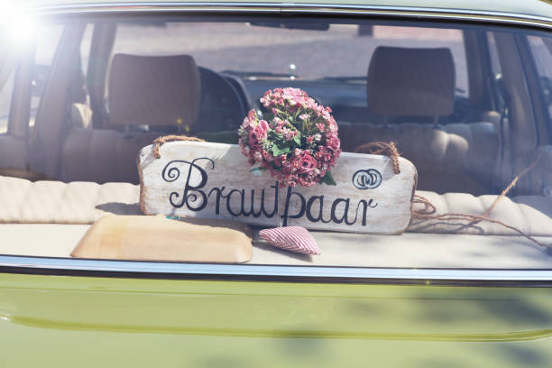 istock Newlyweds signboard car 931126398