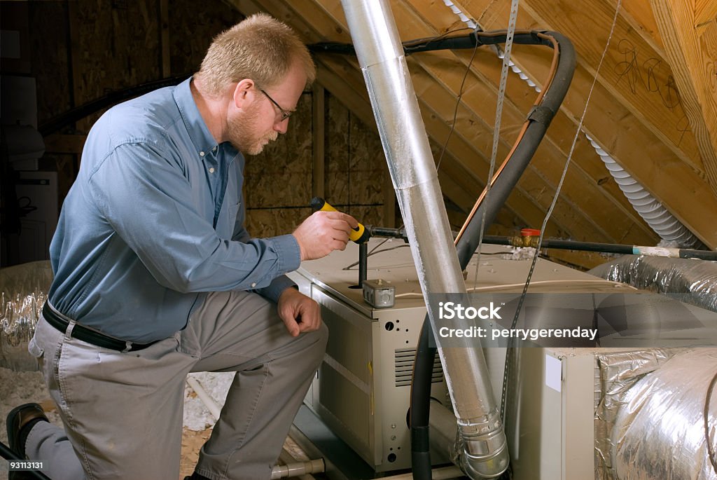 Service Man Inspects Furnace  Furnace Stock Photo