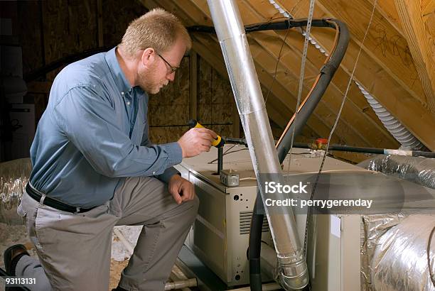 Service Man Inspects Furnace Stock Photo - Download Image Now - Furnace, Examining, Residential Building